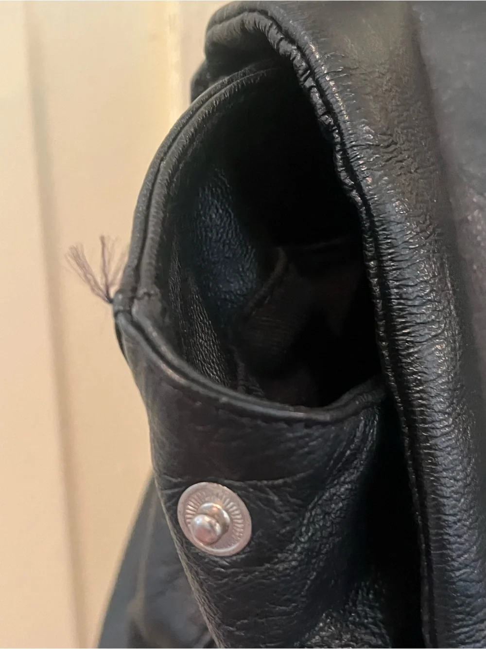 Sleek Black Leather Flap Backpack